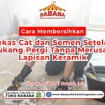 Seorang wanita menggunakan sarung tangan sedang mempraktikkan Cara Menambal Goresan Halus pada Granit Agar Kembali Mulus di meja dapur Toko Pondok Keramik